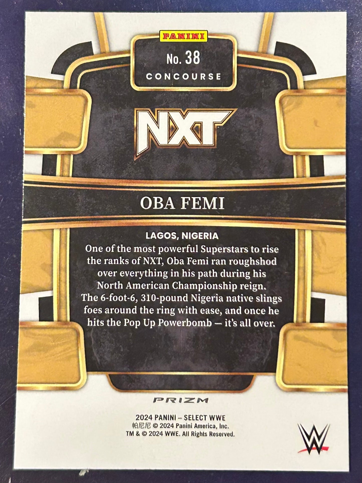 * Oba Femi 2024 WWE Panini Select Concourse Prizm Orange Cracked Ice Refractor ROOKIE Card
