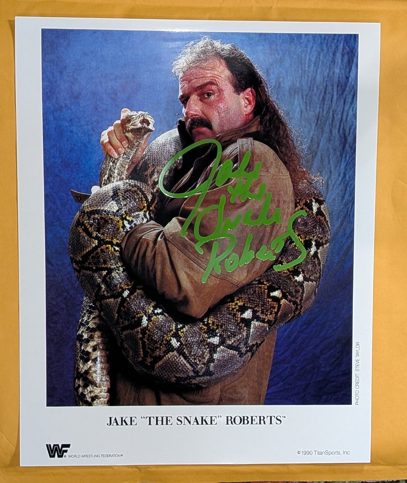 + Jake “The Snake” Roberts Signed WWE 8x10 Color Photo (Comes w/COA)