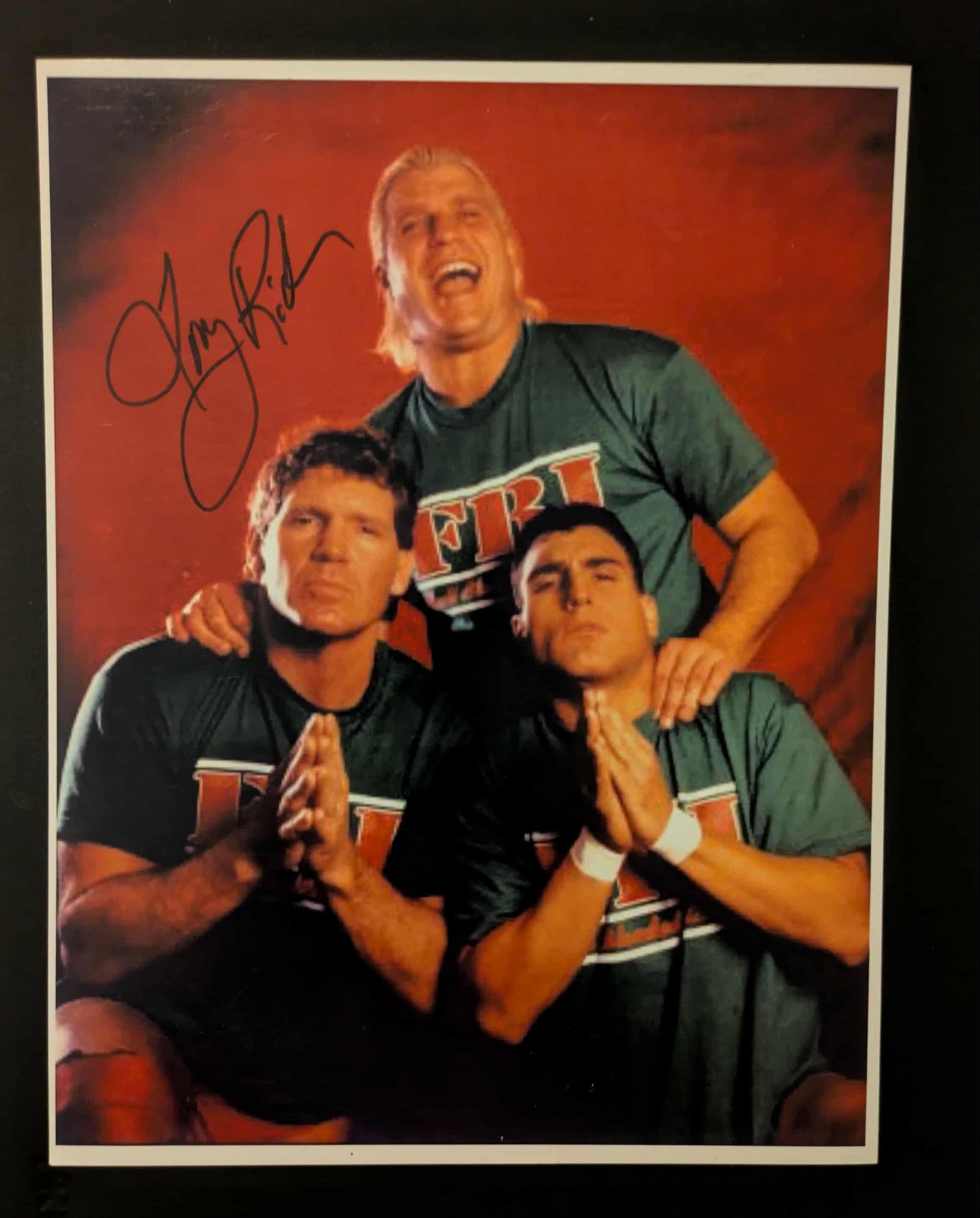 Tommy Rich 8.5x11 FBI ECW Signed Photo (A Little Blurry)