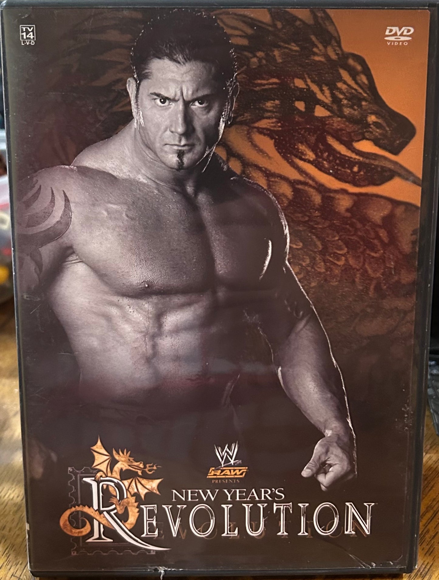 * WWE “New Year’s Revolution 2005” DVD (Benoit, Triple H, Edge & so much more)