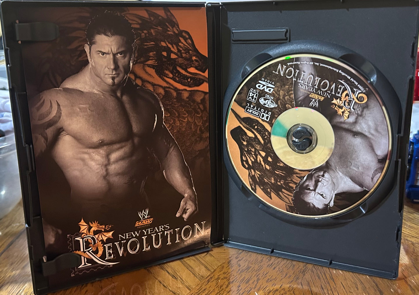 * WWE “New Year’s Revolution 2005” DVD (Benoit, Triple H, Edge & so much more)