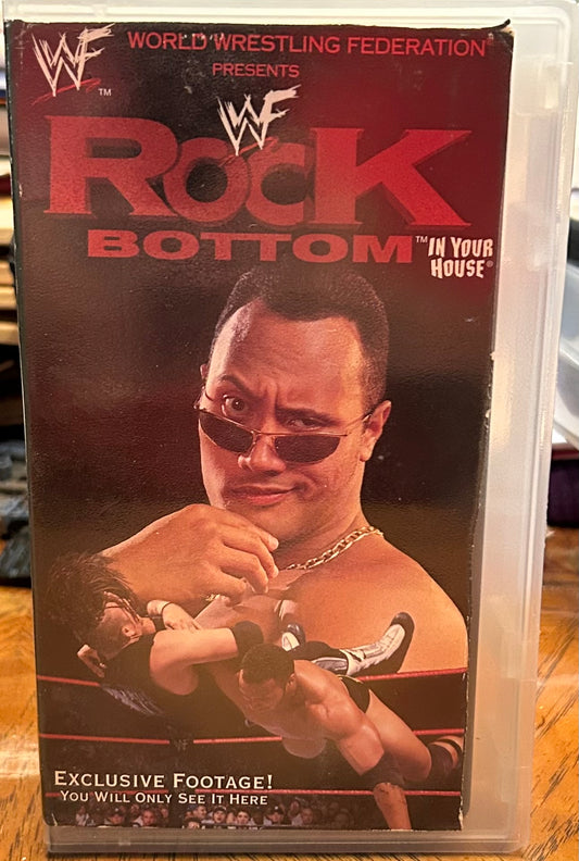 * WWF WWE “Rock Bottom 1998” VHS (WWE Home Video)