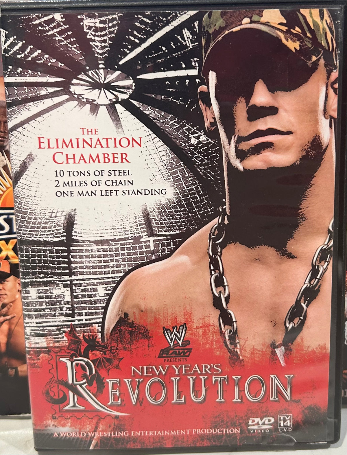 + WWE DVD “New Years Revolution, The Elimination Chamber “ (Cena, Flair, Edge & so much more)