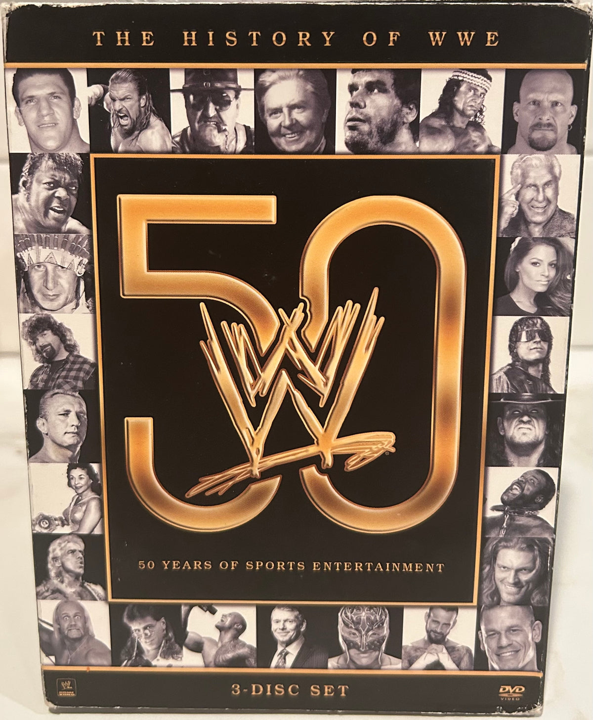 + WWE DVD “The History of WWE, 50 Years of Sports Entertainment” (3-Disc Set)