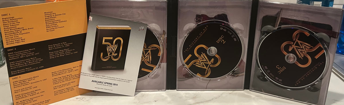 + WWE DVD “The History of WWE, 50 Years of Sports Entertainment” (3-Disc Set)