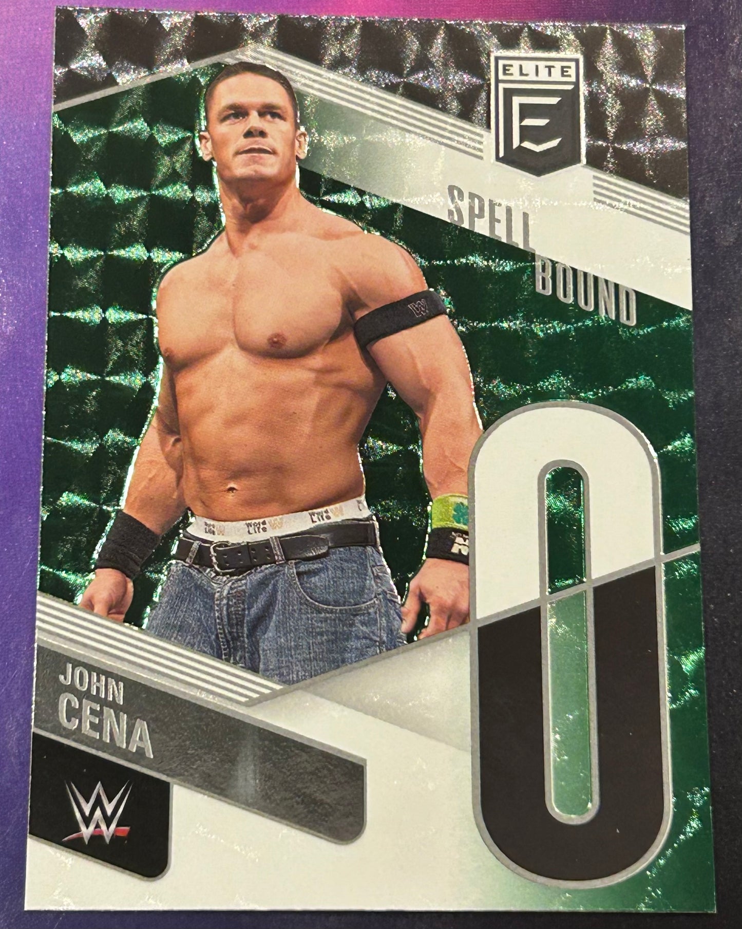 * John Cena 2023 WWE Panini Donruss Elite SPELLBOUND ”O” Green Parallel Insert Card